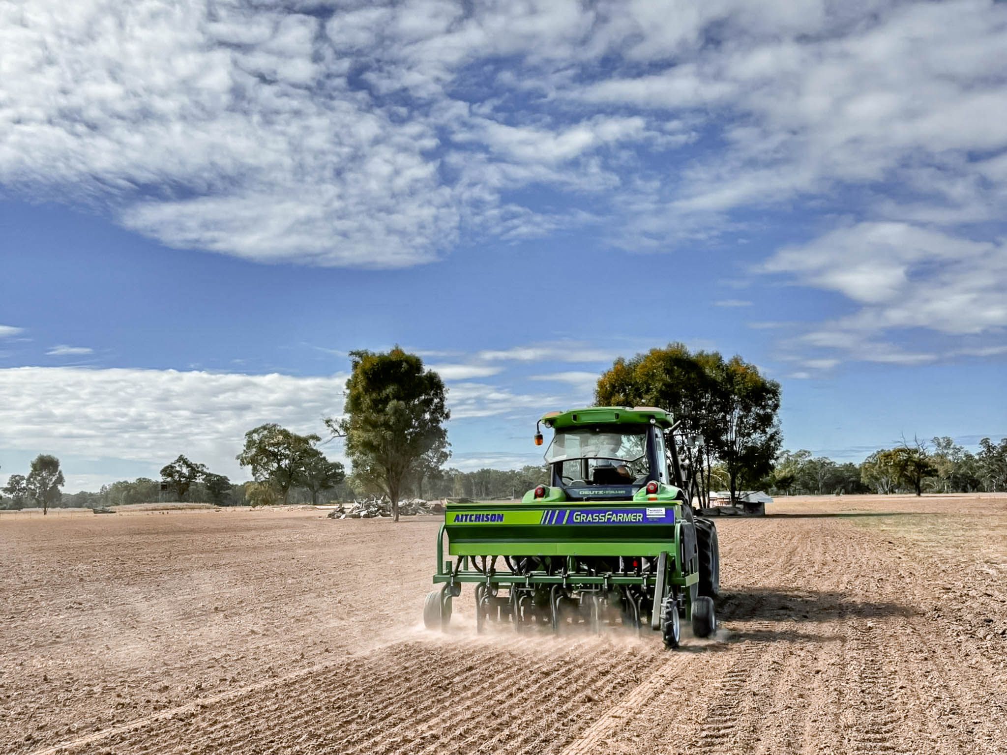 An original-livery GrassFarmer® at work in Australia, delivering reliable seed placement in challenging dry conditions.