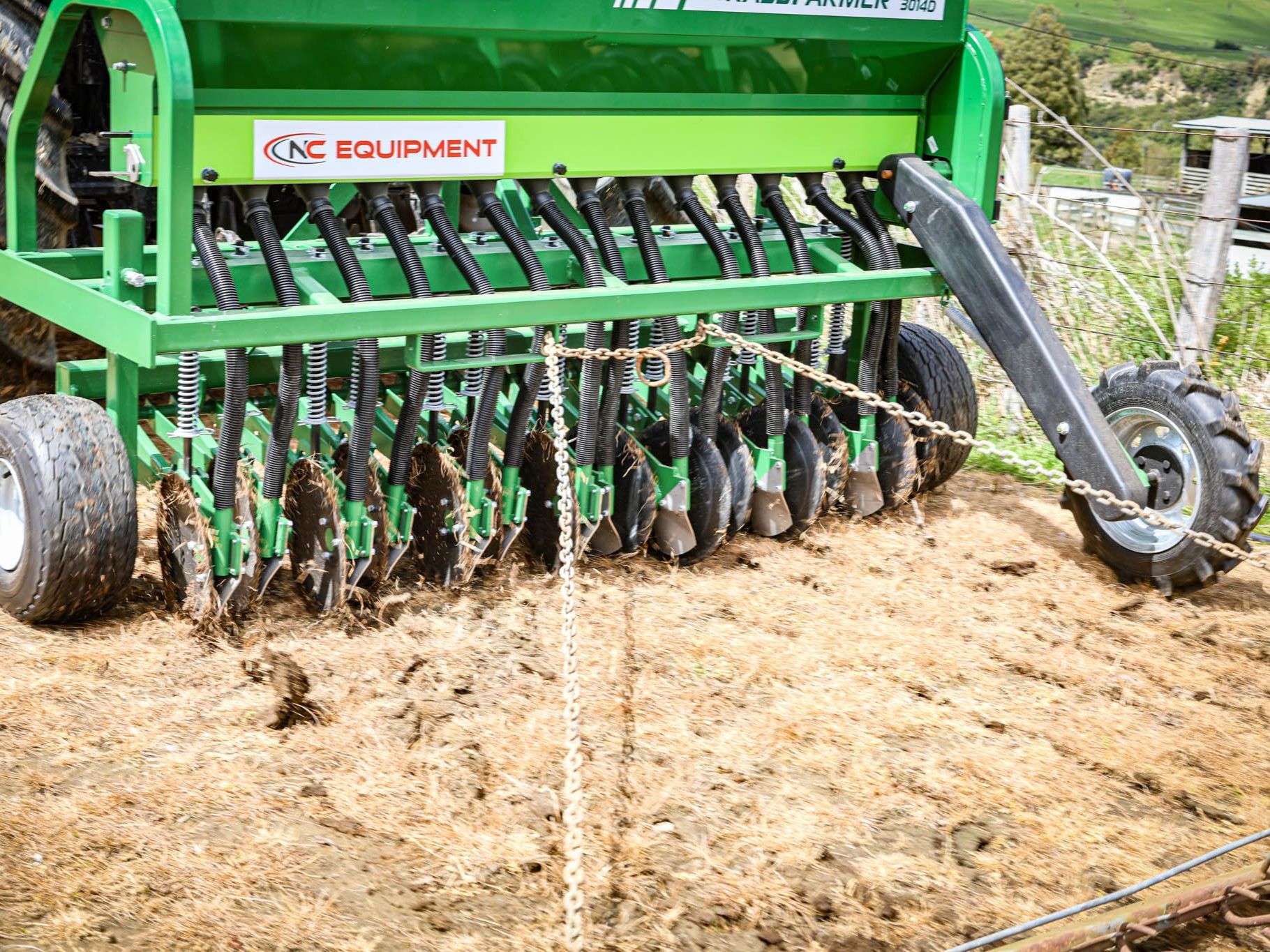 Close-up of Aitchison GrassFarmer disc drill showing minimal soil disturbance after seeding
