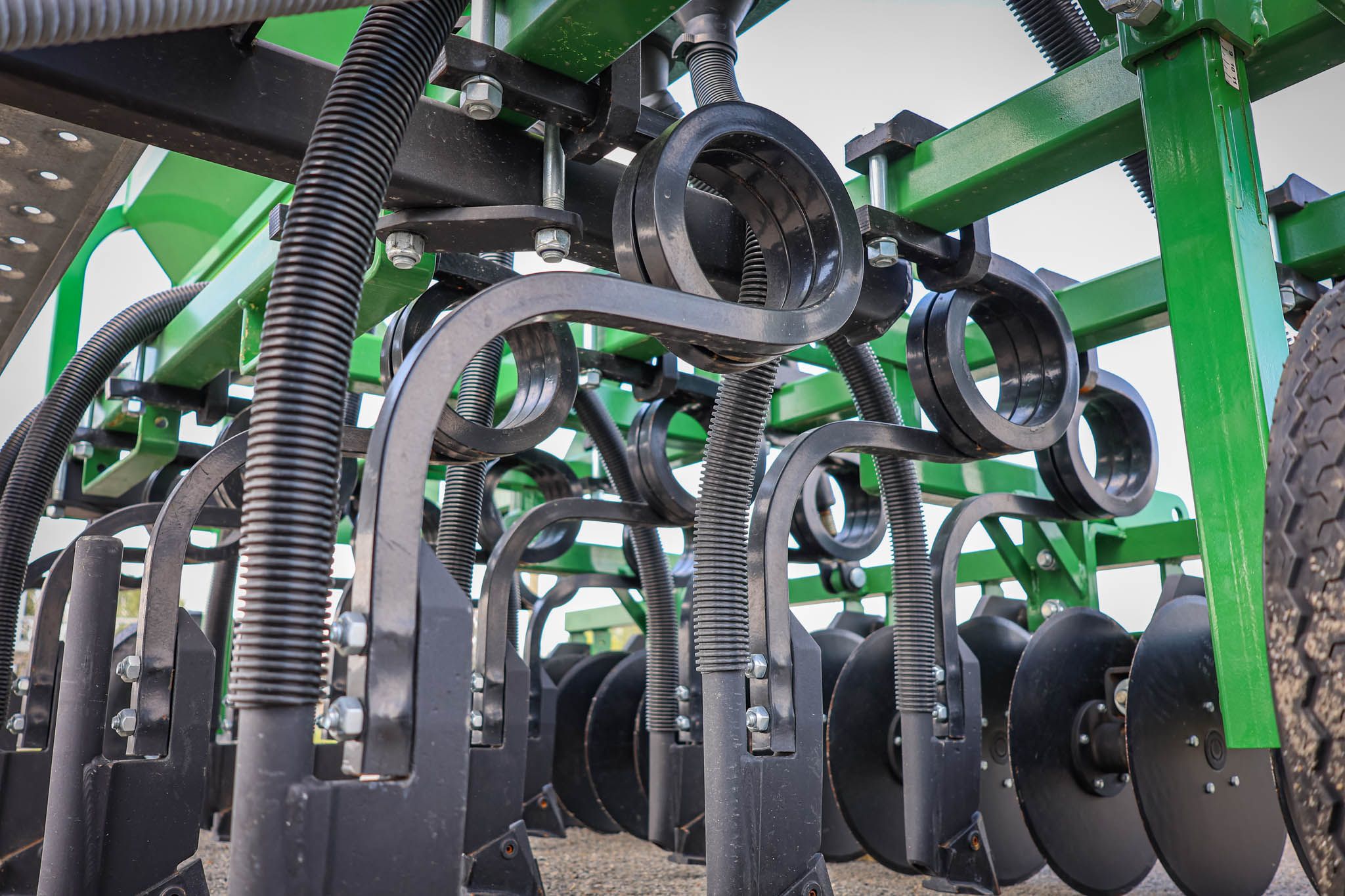 GrassFarmer® 25mm spring steel coil tines designed for straight soil penetration and efficient trash flow in heavy residue conditions
